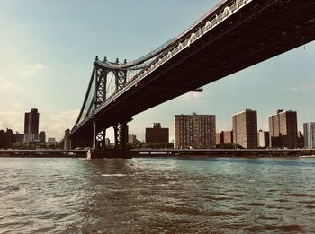 View of bridge over river in city