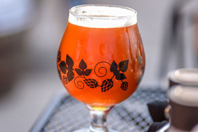 Close-up of beer glass on table