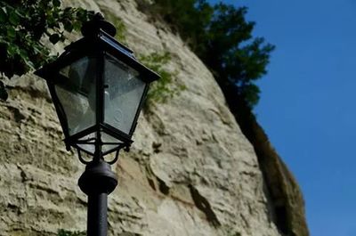 Low angle view of street light against sky