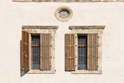 Low angle view of window on old building