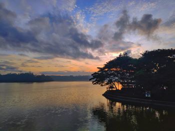 Scenic view of lake against sky during sunset