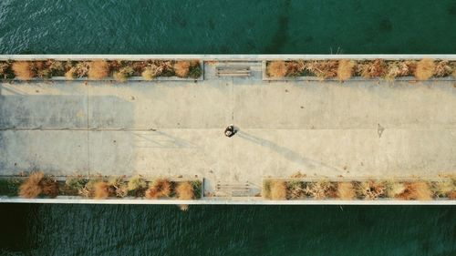High angle view of wall by lake