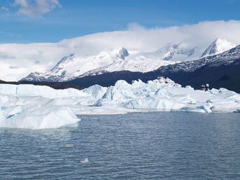 Scenic view of frozen lake against sky