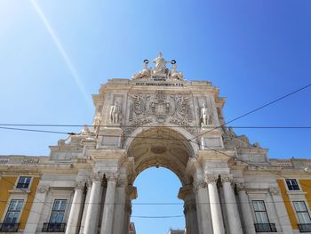 Low angle view of historical building against blue sky