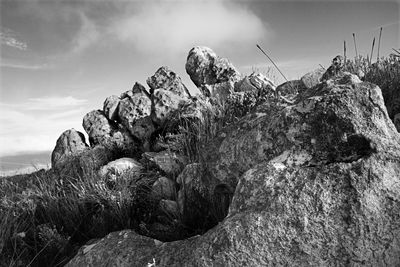 Rock formation on land against sky