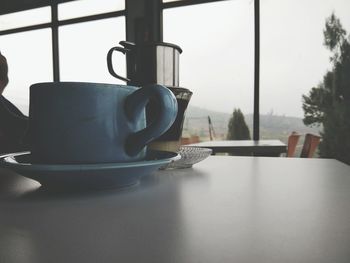 Close-up of coffee cup on table