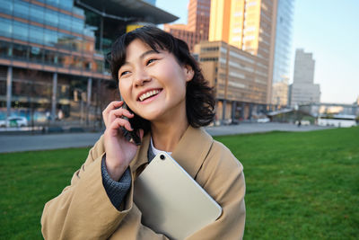 Young woman using mobile phone