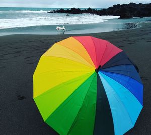 Multi colored umbrella on beach