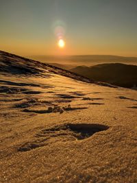 Scenic view of landscape against sky during sunset. mountain peak. romania