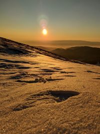 Scenic view of landscape against sky during sunset