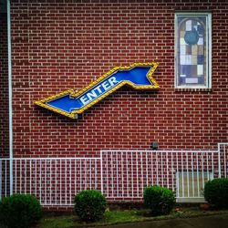 Low angle view of sign on building wall