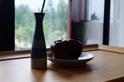 Close-up of ice cream on window sill at home