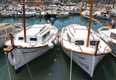 High angle view of boats moored at harbor