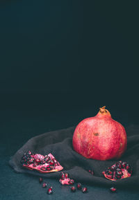 Close-up of red apples on black background