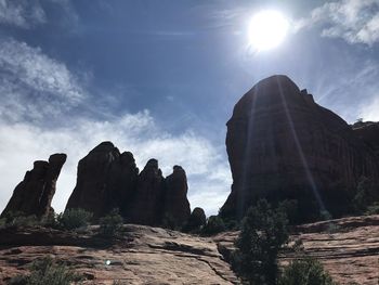 Low angle view of rock formation against sky