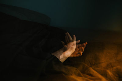 Close-up of woman lying on bed