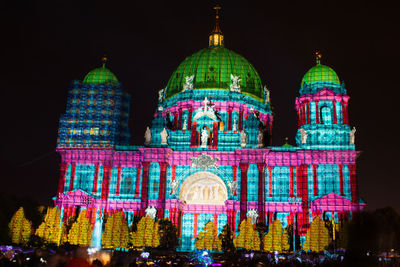 Illuminated building in city at night