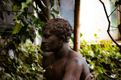 Low angle view of young man standing outdoors