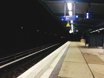 Railroad station platform at night