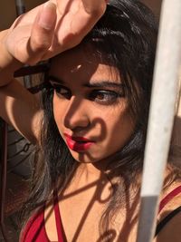 Close-up of beautiful young woman looking away