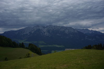 Scenic view of landscape and mountains against sky