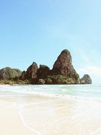 View of beach against blue sky