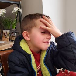 Portrait of boy looking at home