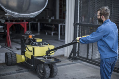 Worker pulling cart factory