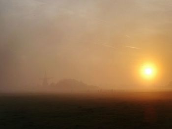 Scenic view of landscape at sunset