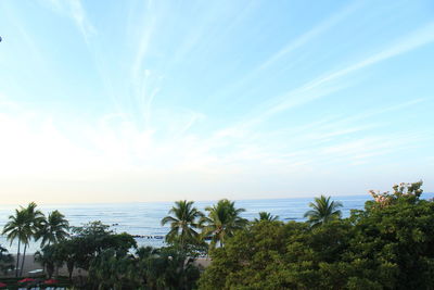 Scenic view of sea against blue sky