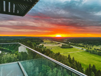 Scenic view of field against sky during sunset