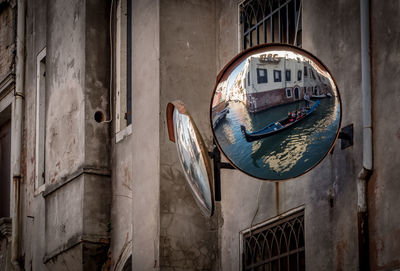 Reflection of building and boat on mirror in venecia