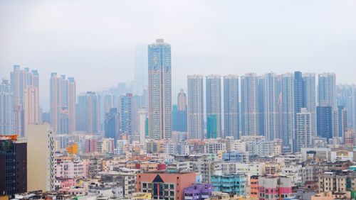 Modern buildings in city against sky