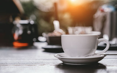 Close-up of coffee cup on table