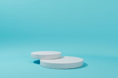 High angle view of white table against blue background