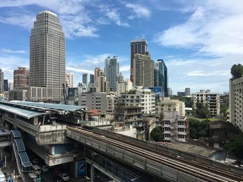 Modern buildings in city against sky