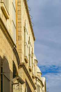 Low angle view of historic building against sky