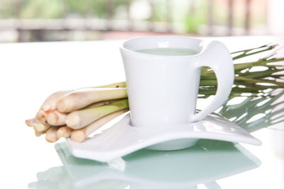 Close-up of coffee cup on table