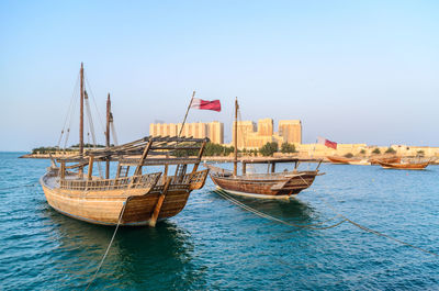 Traditional dhow moored near the museum of islamic art doha, qatar. 