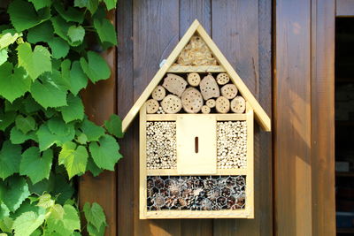 Wooden decor on wall in back yard