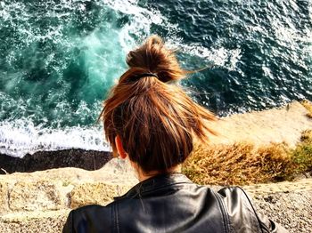 Rear view of woman looking at sea