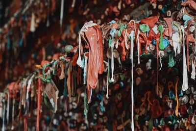 Close-up of bubble gums hanging at market for sale