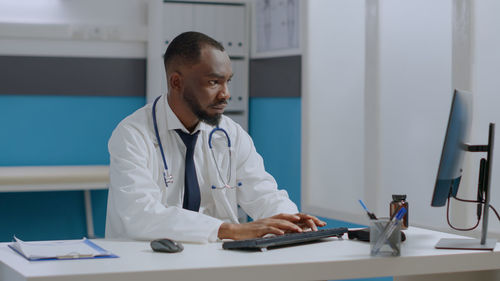 Female doctor working at clinic