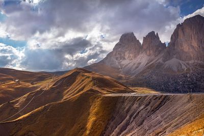 Scenic view of mountains against cloudy sky