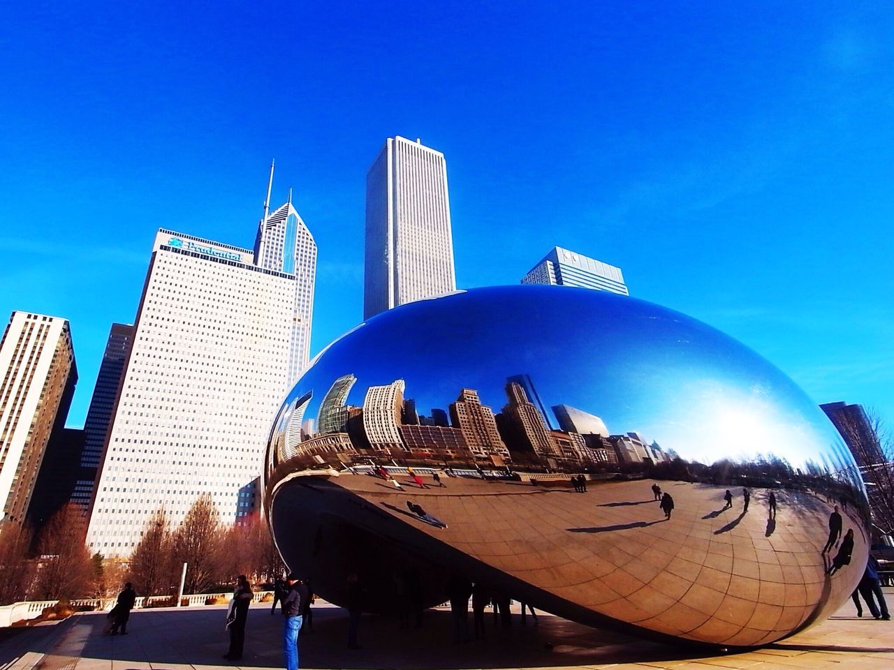 building exterior, low angle view, architecture, blue, built structure, clear sky, city, modern, tall - high, skyscraper, sky, outdoors, tower, office building, day, sunlight, building, reflection, no people, arts culture and entertainment