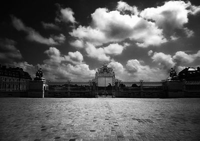 Buildings against cloudy sky