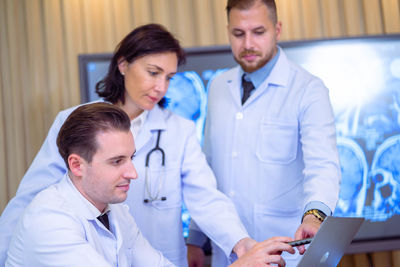 Female doctor examining patient at clinic