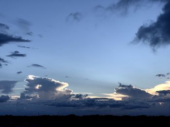 Low angle view of silhouette trees against sky at sunset