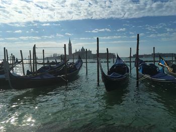 Boats moored in canal