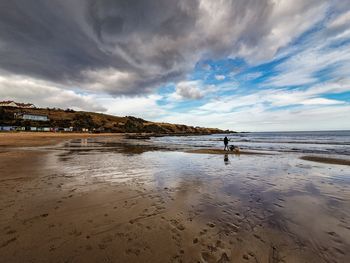 Scenic view of beach against sky